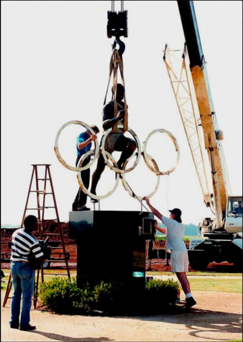 Statue-being-permanently-anchored-on-its-base-within-only-a-few-days-ahead-of-the-Olympic-torch-arrival
