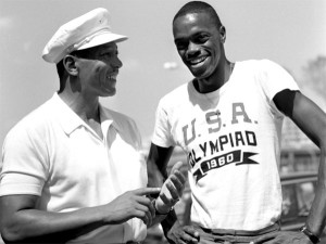Jesse Owens (left) with long jumper Ralph Boston in 1960. Boston had recently broken Owens’ record jump of 26’-11 1/4th” by three inches, putting him in the distinguished company of Owens who won four gold medals in the Berlin games.